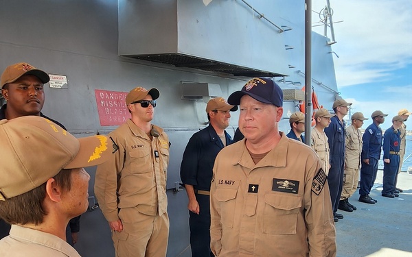 Chaplain Judson Dunlap is rung ashore having completed his assignment onboard USS Ted Stevens (DDG 128).