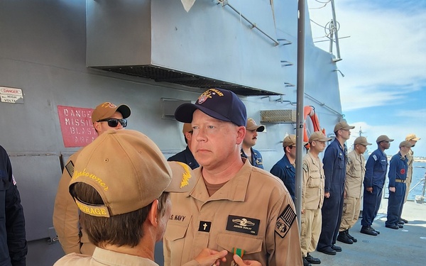 Chaplain Judson Dunlap is rung ashore having completed his assignment onboard USS Ted Stevens (DDG 128).