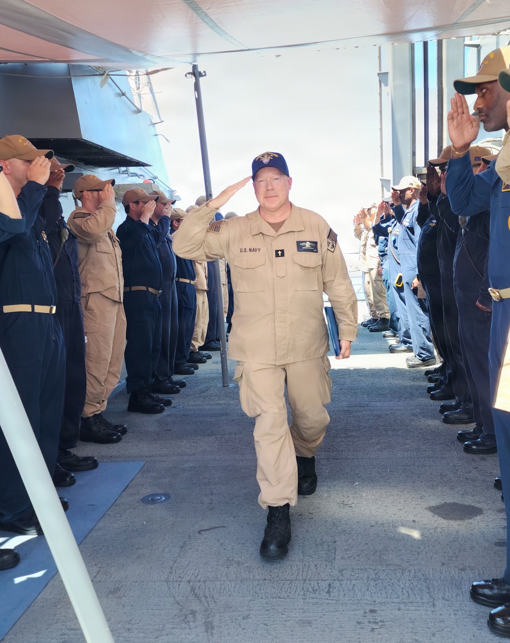 Chaplain Judson Dunlap is rung ashore having completed his assignment onboard USS Ted Stevens (DDG 128).