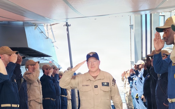 Chaplain Judson Dunlap is rung ashore having completed his assignment onboard USS Ted Stevens (DDG 128).