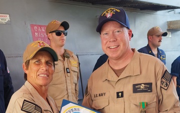 Chaplain Judson Dunlap is rung ashore having completed his assignment onboard USS Ted Stevens (DDG 128).