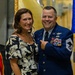 U.S. Air Force Chief Master Sergeant poses with spouse during military ceremony