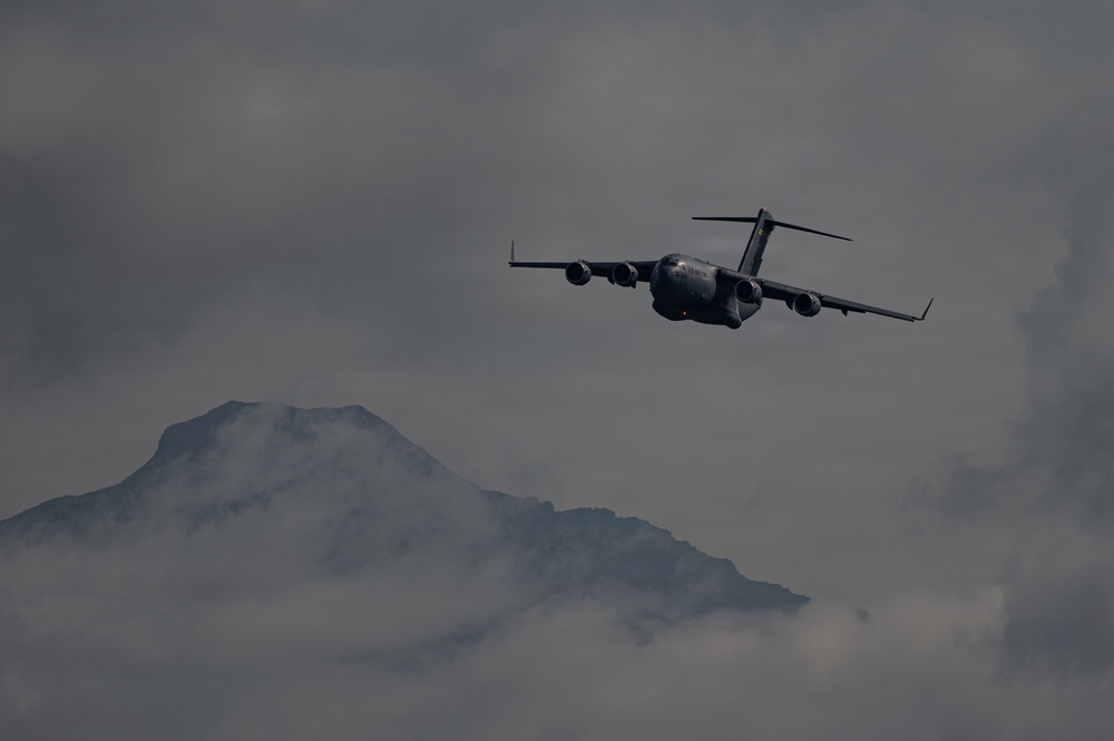 A C-17 Globemaster III aircraft performs an aerial demonstration during the Arctic Thunder Open House 2026