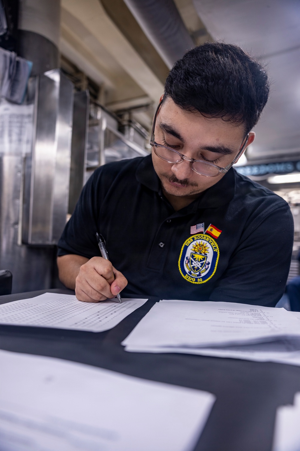 Sailors Take Damage Control Test On Messdecks