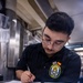 Sailors Take Damage Control Test On Messdecks