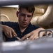 Sailors Conduct Routine Maintenance In Engine Room