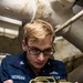 Sailors Conduct Routine Maintenance In Engine Room