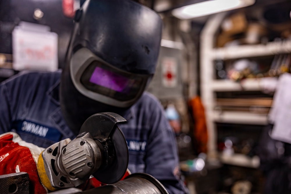 Hull Maintenance Technician Prepares KLE Gift