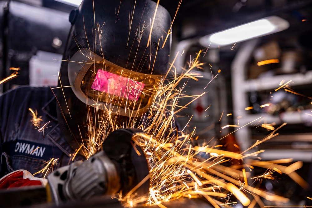 Hull Maintenance Technician Prepares KLE Gift