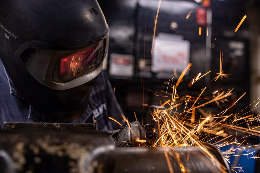 Hull Maintenance Technician Prepares KLE Gift