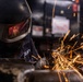 Hull Maintenance Technician Prepares KLE Gift