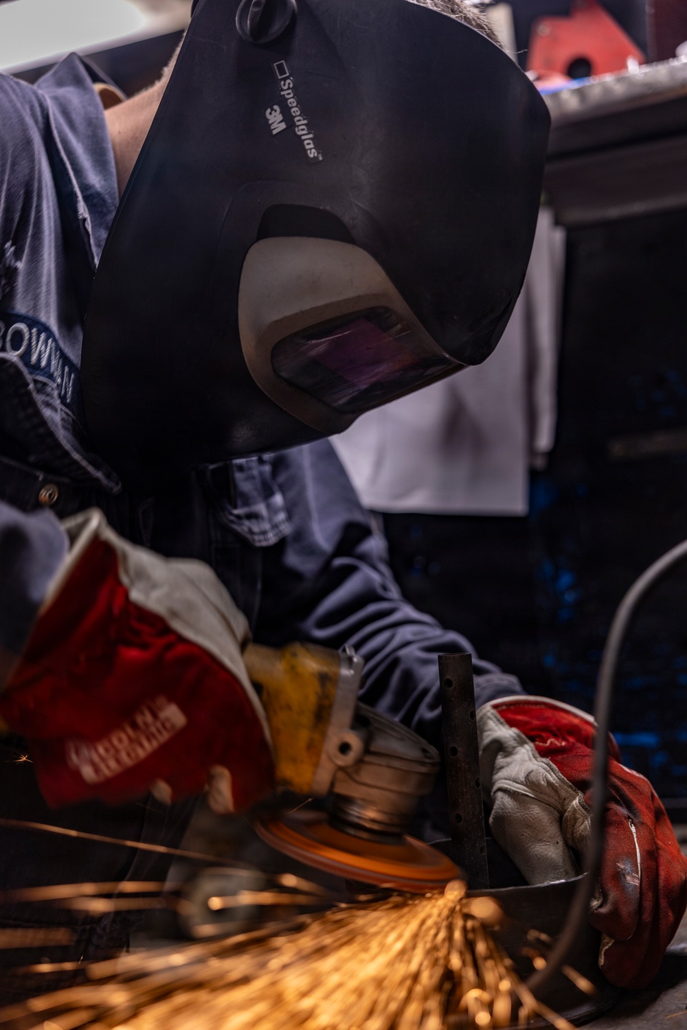 Hull Maintenance Technician Prepares KLE Gift