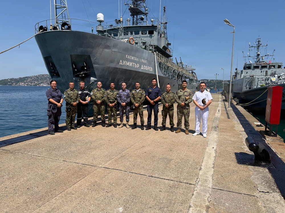U.S. Navy Lt. Jaramillo Poses with Allied Officers