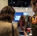 Senior leaders with the Defense Health Agency tour AD-RDA/CAE display during MHSRS 2026