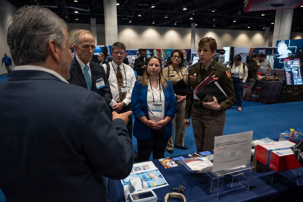 Senior leaders with the Defense Health Agency tour AD-RDA/CAE display during MHSRS 2026