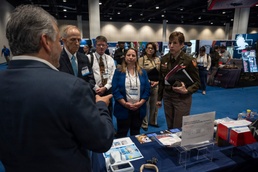 Senior leaders with the Defense Health Agency tour AD-RDA/CAE display during MHSRS 2026
