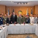 A formal group photo of approximately 20 military and civilian officials gathered in a conference room, with both Philippine and American flags visible in the background along with an official seal. Name placards on the conference table identify key participants including H.E. Lee Lipton, ADM Samuel J. Paparo (USN), GEN Antonio G. Navarrete (PN), and ASEC Monita B. Rodriguez. The setting suggests a bilateral military or defense cooperation meeting between the United States and the Philippines.