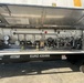 The image shows the open valve and plumbing compartment of a cryogenic or industrial tank trailer manufactured by Pratt, identified by unit number EURZ 430466 with a tare weight of 7,540 lbs. The compartment reveals an extensive array of valves, gauges, pipes, and fittings typical of a liquid gas or chemical transport tanker. The equipment appears to be in operational condition with the access panel fully open for inspection or servicing.