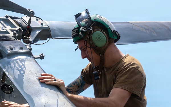 John Finn Washes A Helicopter