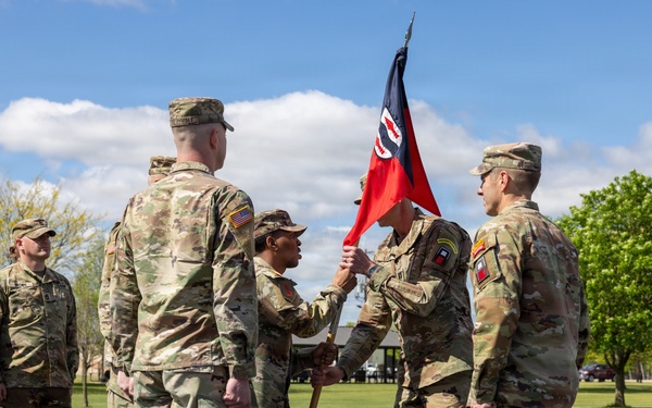 First Sergeant Passes Guidon to Outgoing Commander