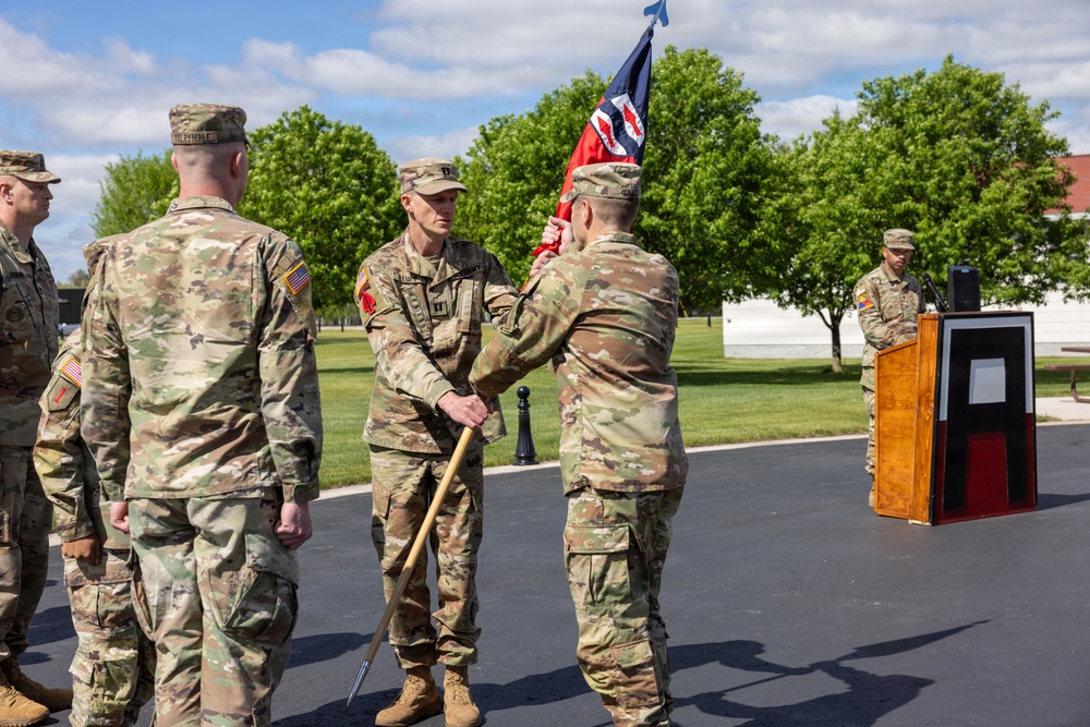 Outgoing Commander Passes Guidon to Brigade Commander