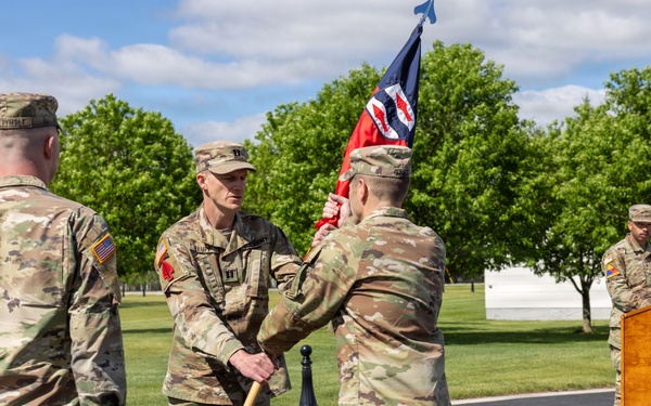 Outgoing Commander Passes Guidon to Brigade Commander