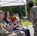 Soldier Hands Red Roses to Family