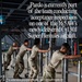 The image shows military personnel in camouflage uniforms pushing wheeled metal stands or jacks inside an aircraft hangar. The graphic overlay text identifies this as an acceptance inspection of a newly delivered C-130J Super Hercules aircraft belonging to the 165th Airlift Wing (165 AW). A quote from 'Pardo' emphasizes the importance of correcting issues before the aircraft enters service.