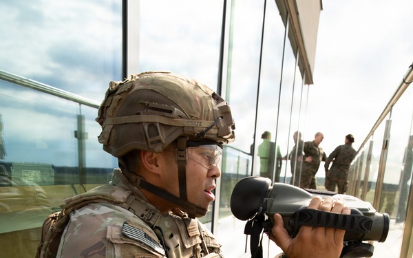 U.S. and British soldiers build interoperability as Paladins fire during range training
