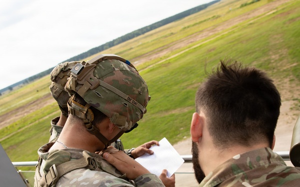 U.S. and British soldiers build interoperability as Paladins fire during range training
