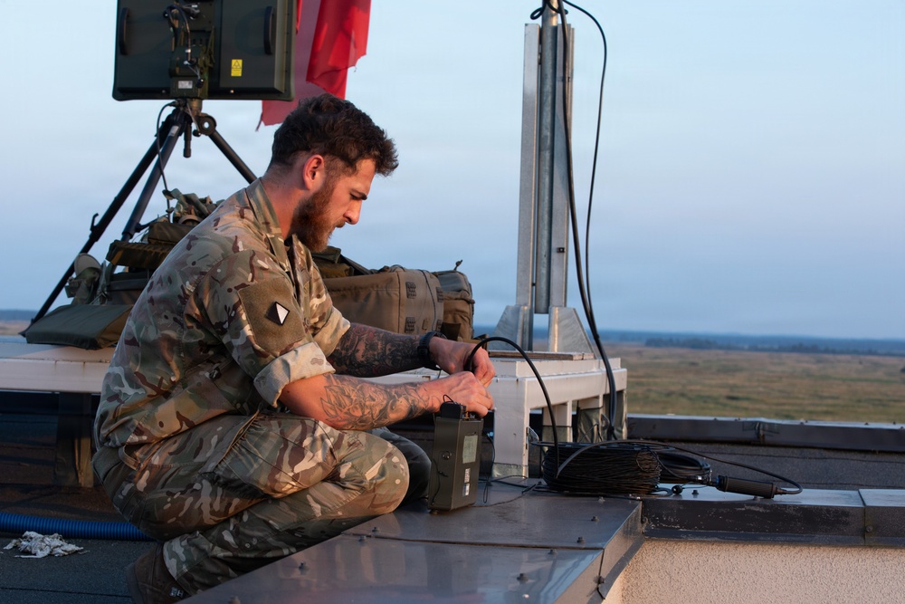 U.S. and British soldiers build interoperability as Paladins fire during range training