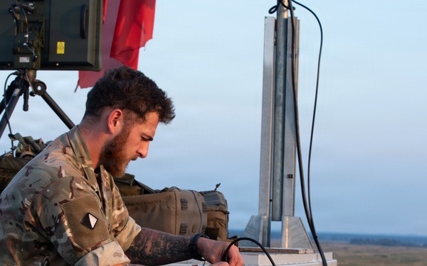 U.S. and British soldiers build interoperability as Paladins fire during range training