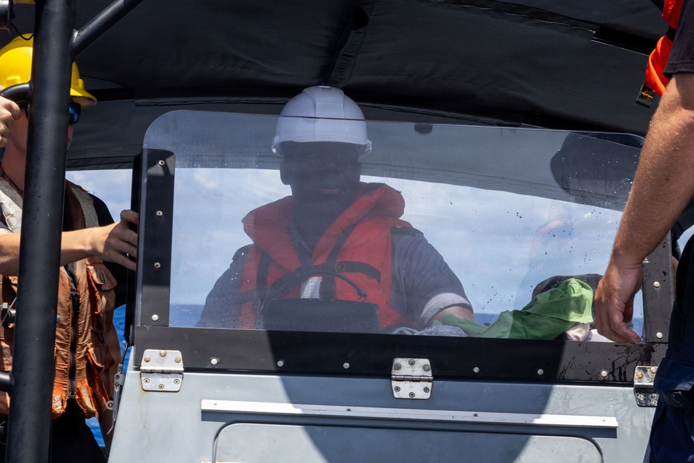 RBDF Midshipman drives a Navy RHIB