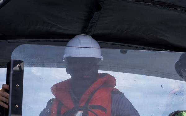 RBDF Midshipman drives a Navy RHIB
