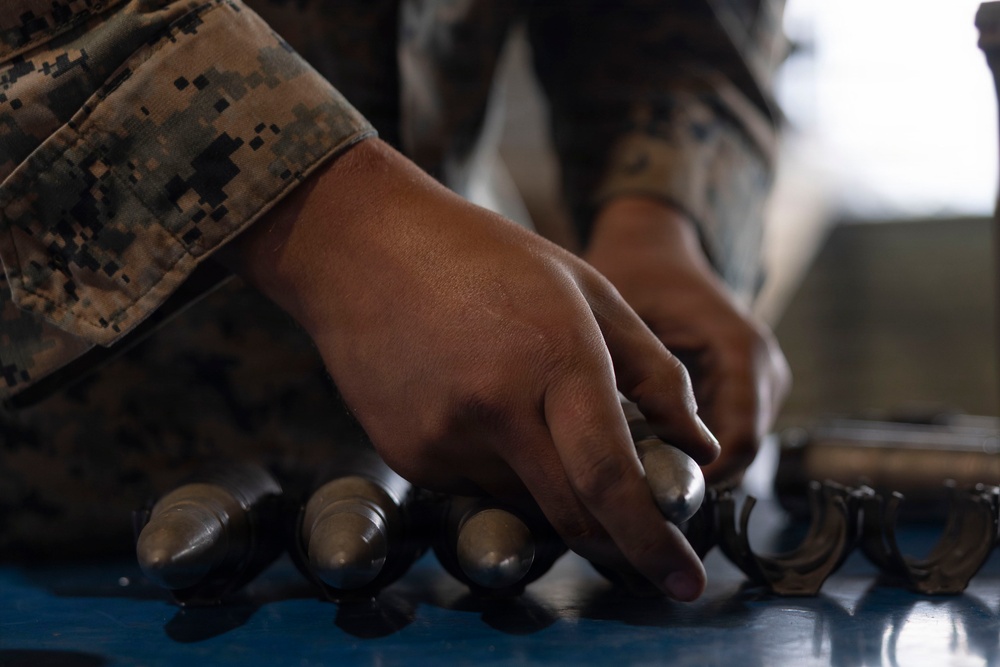 U.S. Marines with 1st LAR prepare for battle carry drills during Coral-Balmoral Cup