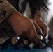 U.S. Marines with 1st LAR prepare for battle carry drills during Coral-Balmoral Cup