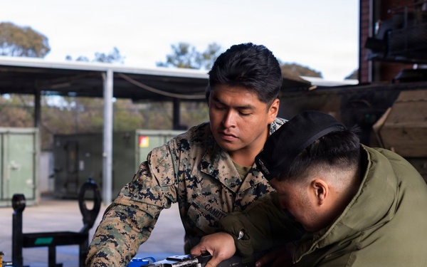 U.S. Marines with 1st LAR prepare for battle carry drills during Coral-Balmoral Cup