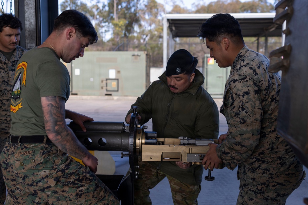 U.S. Marines with 1st LAR prepare for battle carry drills during Coral-Balmoral Cup