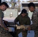 U.S. Marines with 1st LAR prepare for battle carry drills during Coral-Balmoral Cup