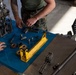 U.S. Marines with 1st LAR prepare for battle carry drills during Coral-Balmoral Cup