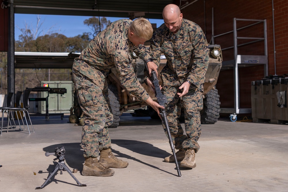 U.S. Marines with 1st LAR prepare for battle carry drills during Coral-Balmoral Cup