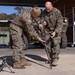 U.S. Marines with 1st LAR prepare for battle carry drills during Coral-Balmoral Cup
