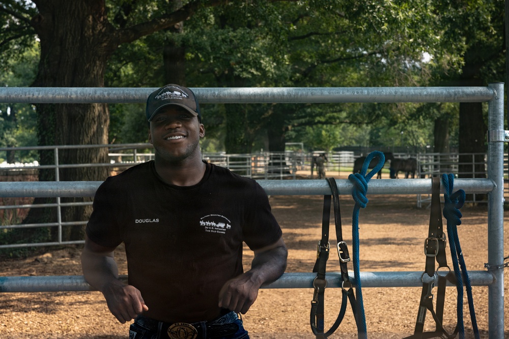 Military Mounted Battalion Soldiers Conduct Stable Duties at Caisson Village