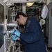 Frank E. Petersen Jr. Sailor Conducts Maintenance