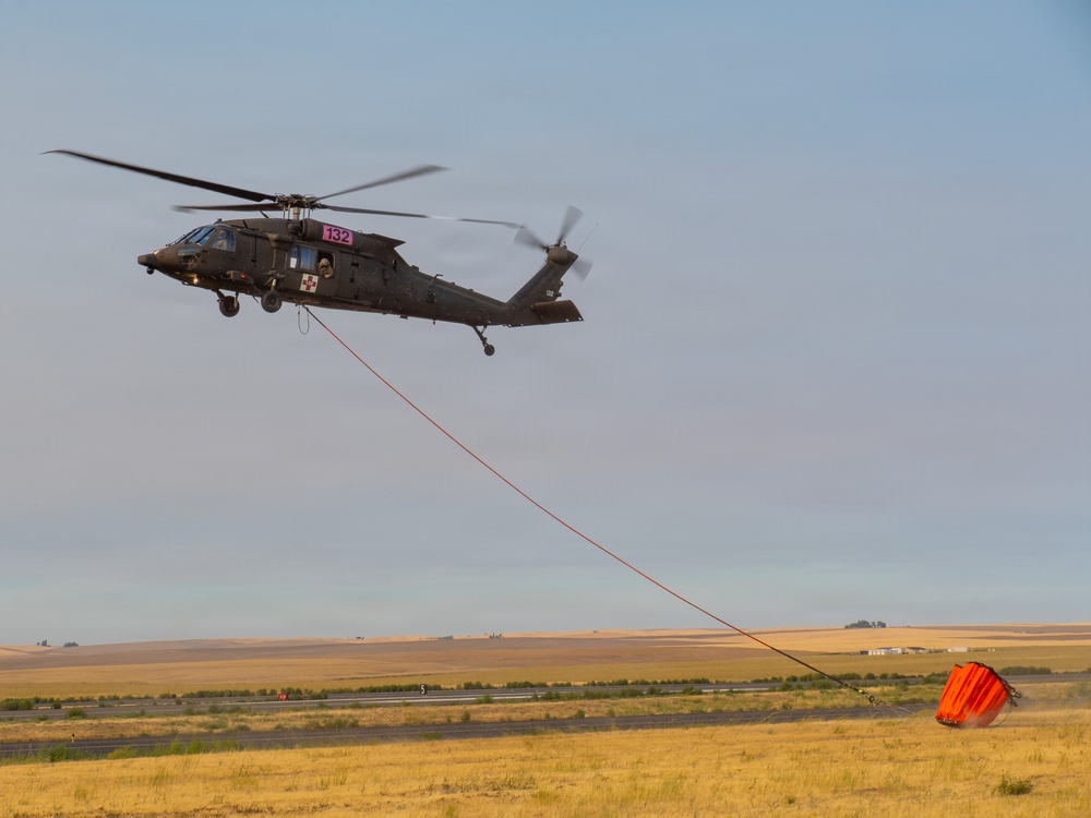 Oregon Guard HH-60 crew drops water on Hagen Fire