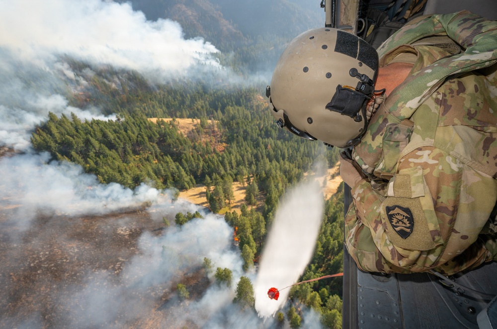 Oregon Guard HH-60 crew drops water on Hagen Fire