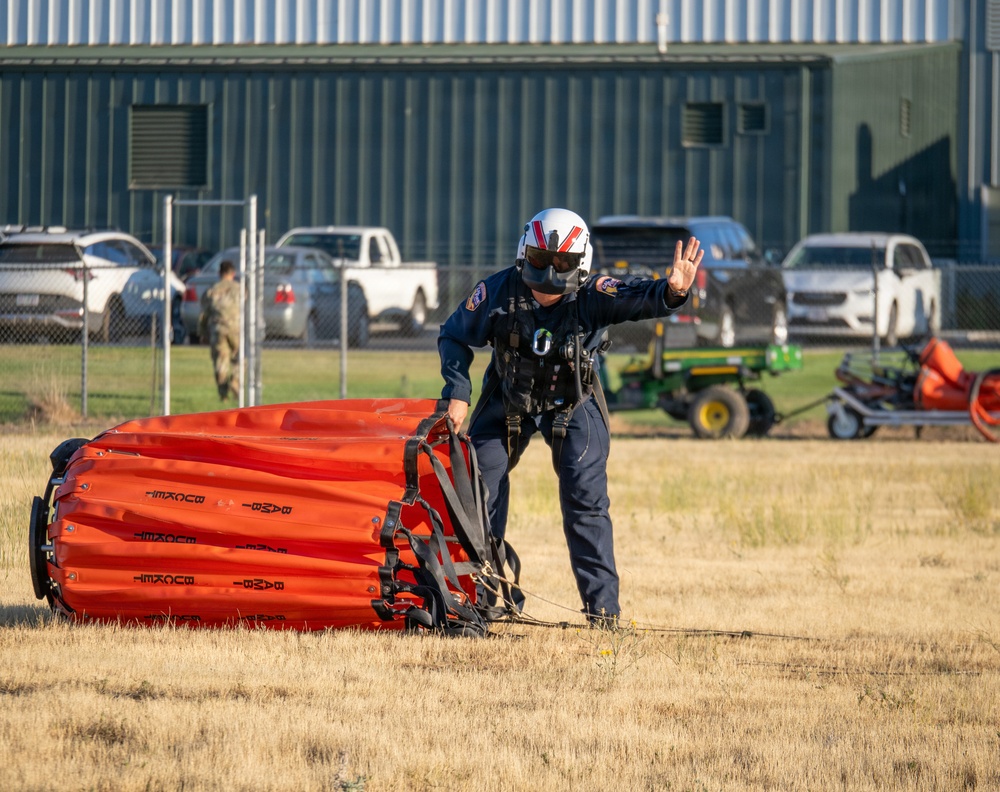 Oregon Guard HH-60 crew drops water on Hagen Fire