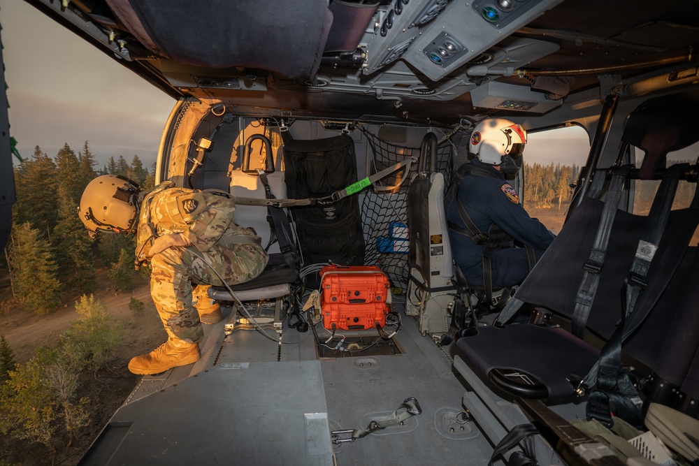 Oregon Guard HH-60 crew drops water on Hagen Fire