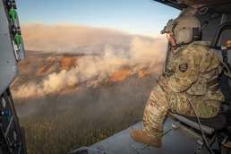 Oregon Guard HH-60 crew drops water on Hagen Fire