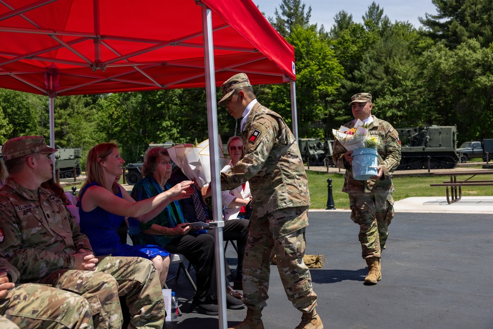 Soldier Passes Roses to Family